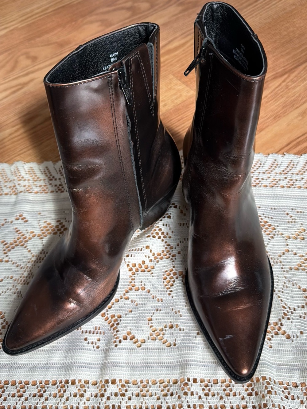 Brown leather boots with a pointed toe